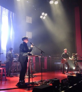 Photo of the band Queens of the Stone Age live.