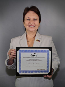 Photo of Patricia Fundora holding her award.