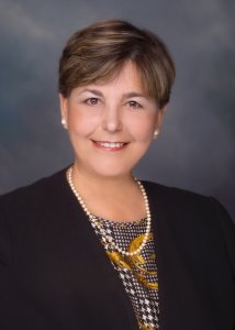 Headshot of Gina Cortes-Suarez.