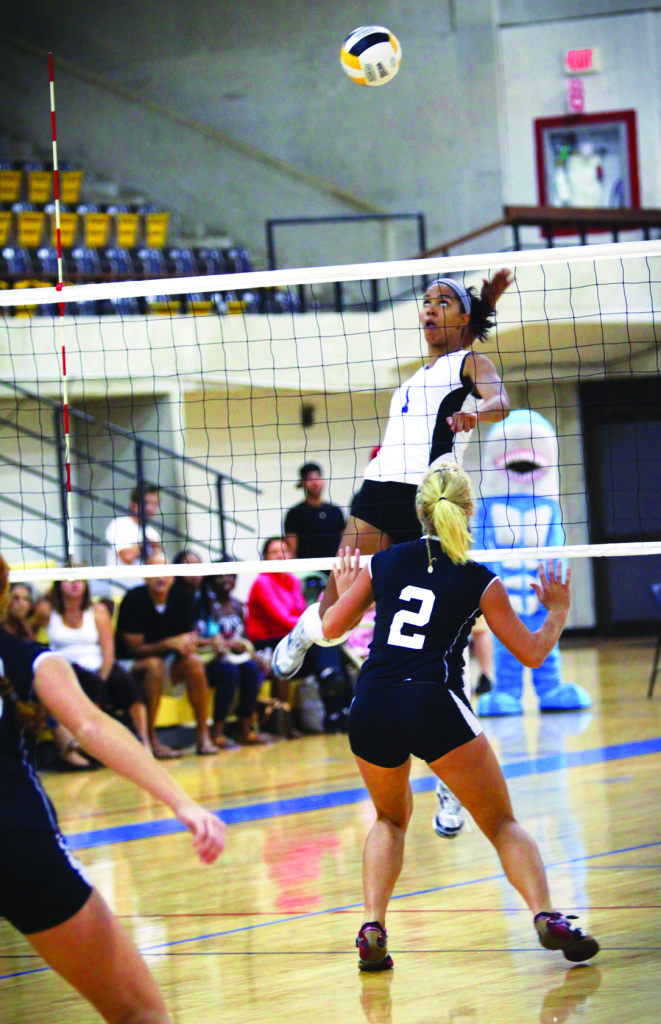 Marifanch Rodriguez spiking the ball.