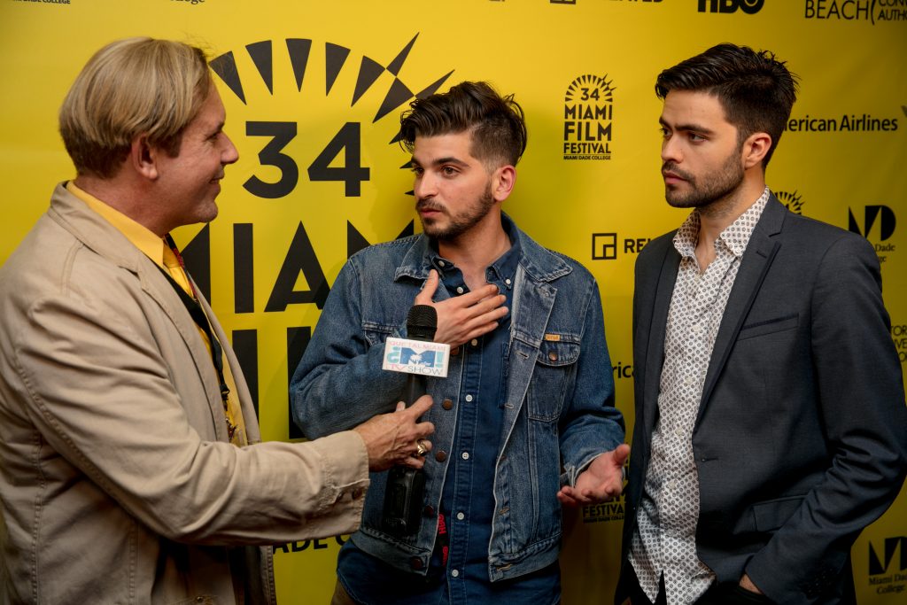 Photo of Jorge Thielen Armand and Rodrigo Michelangeli being interviewed.