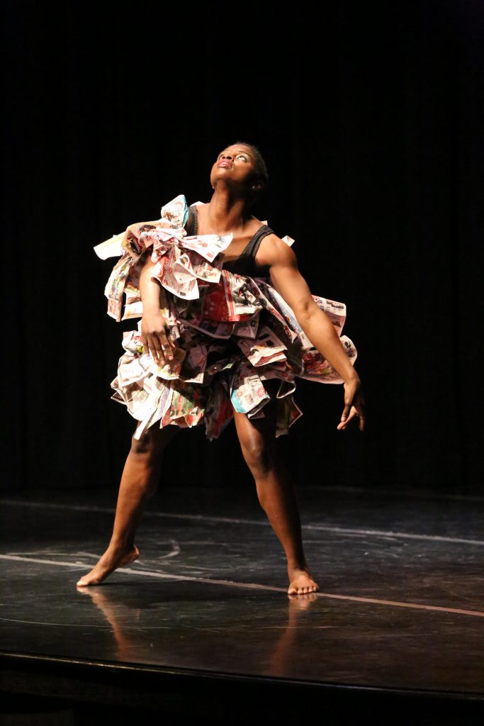 Student performing a dance called "Stand."