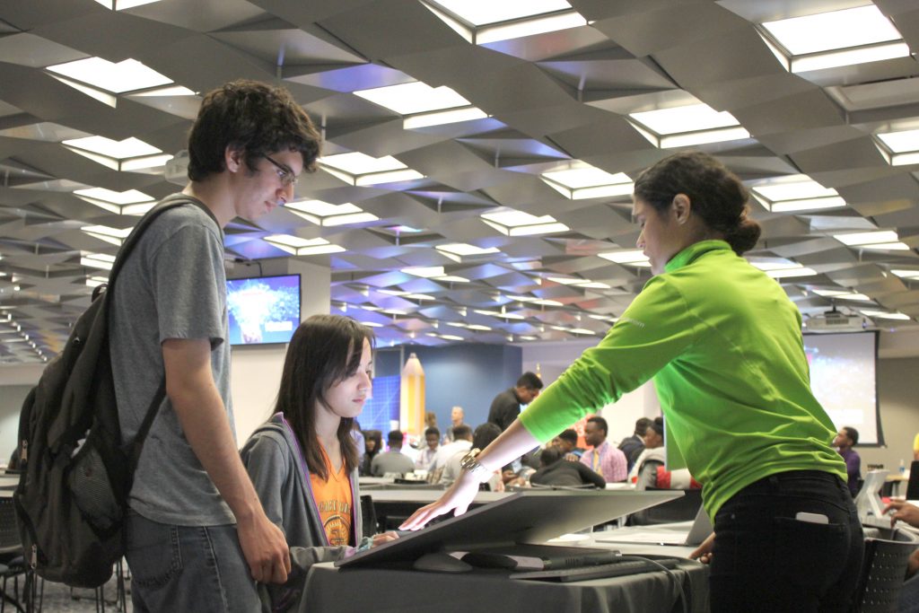 Students talking to a MIcrosoft representative.