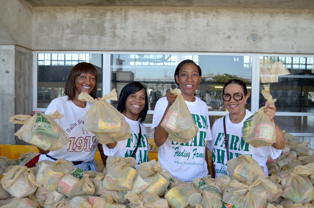 Volunteers posing for the camera at the "Back To School" Food Distribution Event.