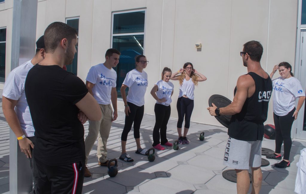Students doing yoga and working out.