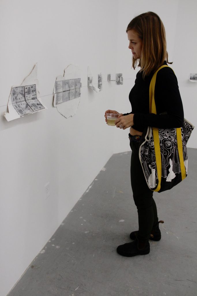 Woman looking at the artwork.