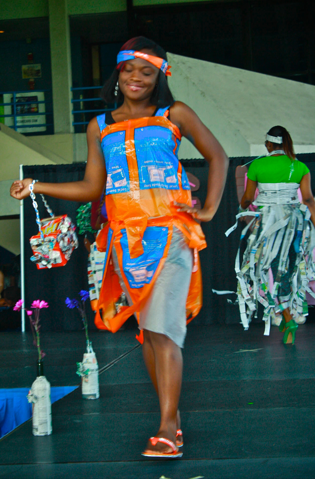 A student walking down the runway.