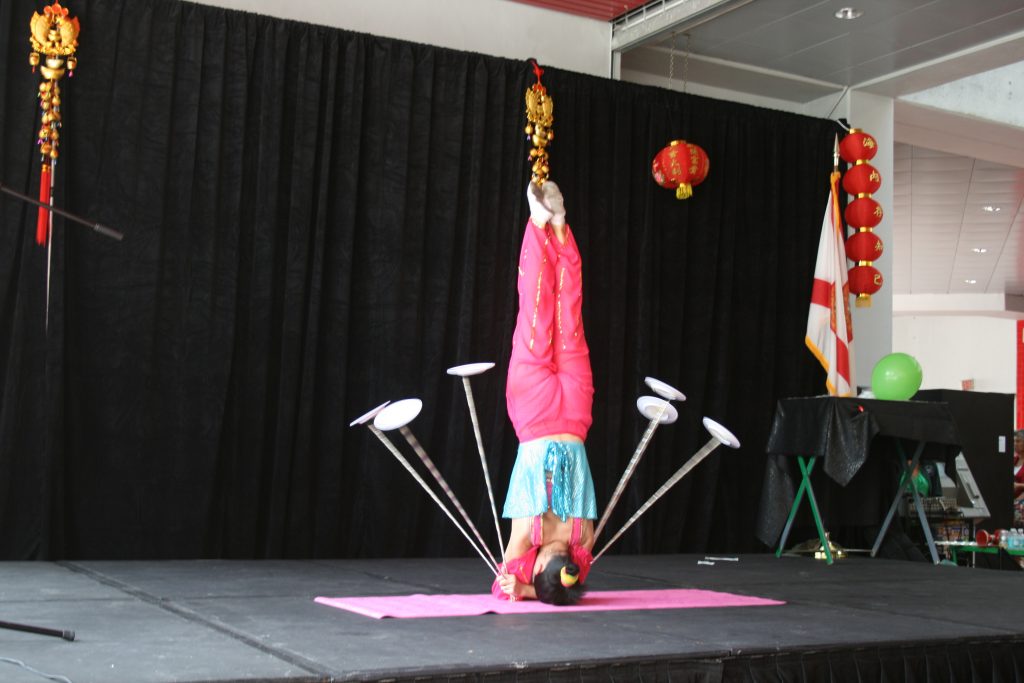 An acrobat performing on stage.