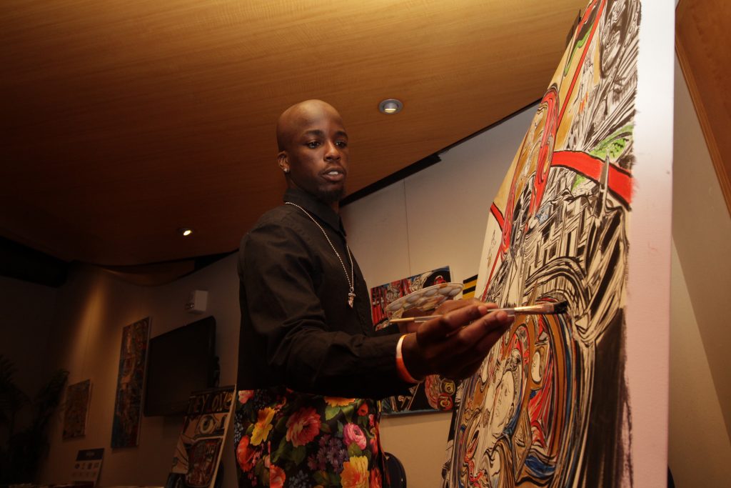 Artist Thabiti Harris painting live at Miami Urban Music & Film Festival.