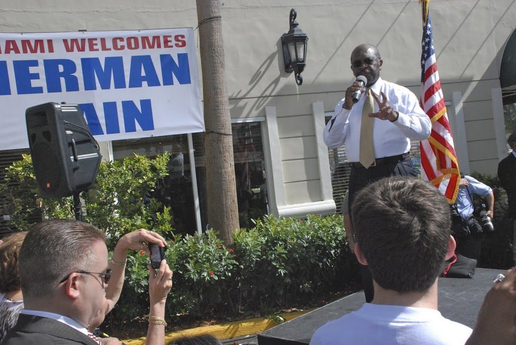 Herman Cain giving a speech.