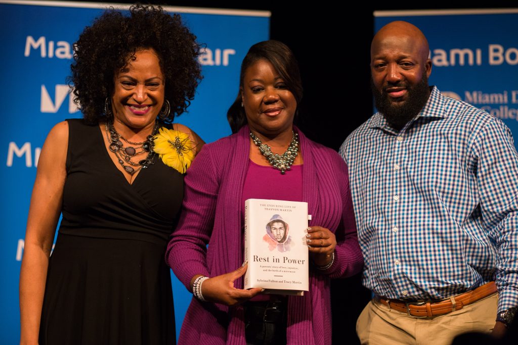 Trayvon Martin's parents posing with their new book.