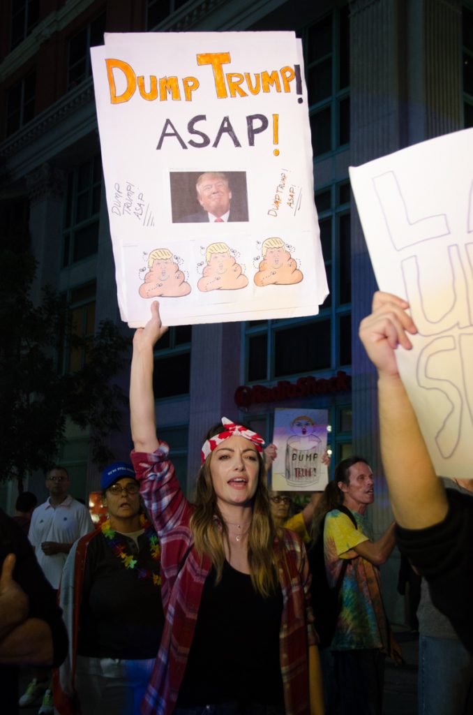 A Trump protester holding up a sign.