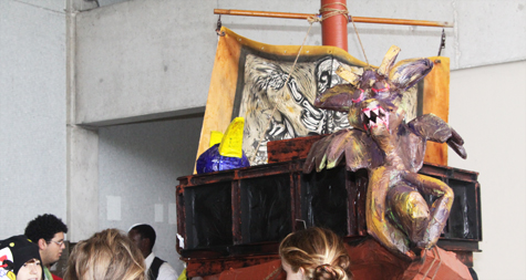 A life-size paper-mache boat.