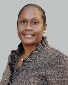 Headshot of Malou C. Harrison. restructuring