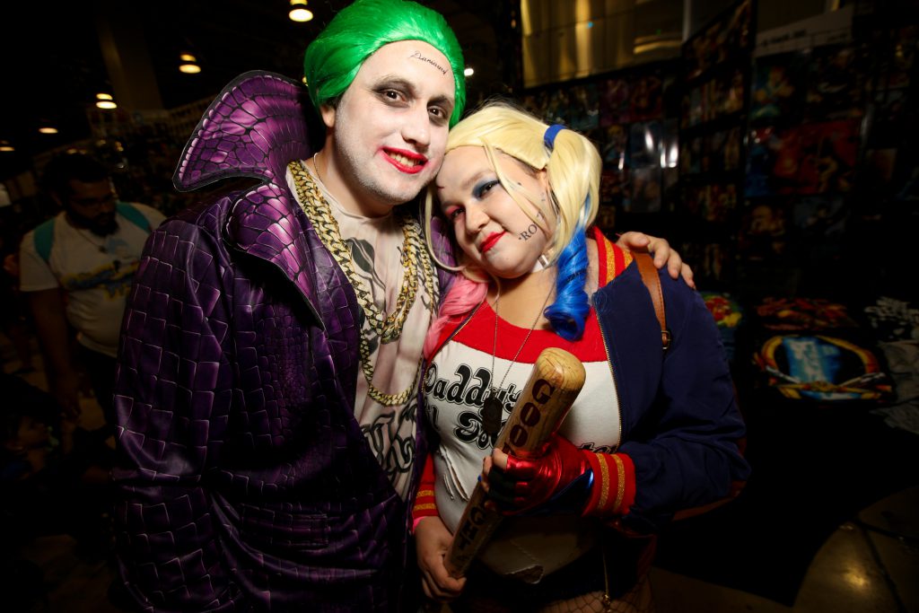 Cosplayers Ramon Diaz and Christy Rivera dressed as The Joker and Harley Quinn.