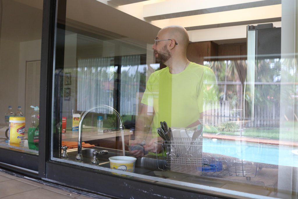 Lopez at home in the kitchen.