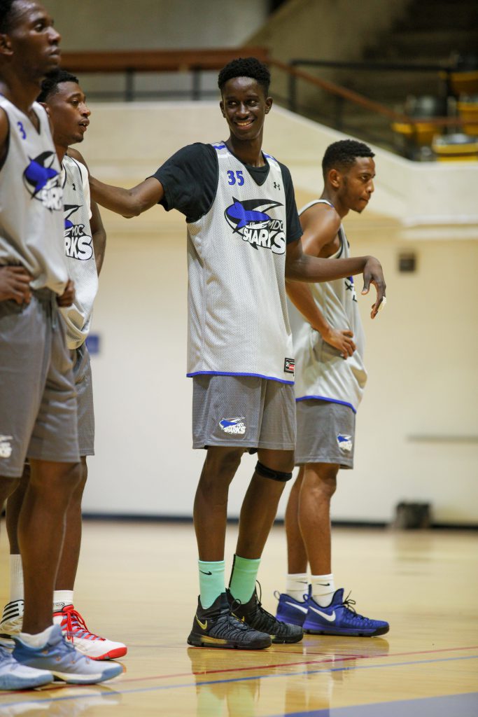 Cheikh Kebe on the court with teammates during practice.