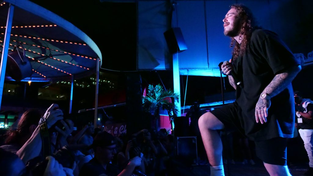 Post Malone performing on stage.