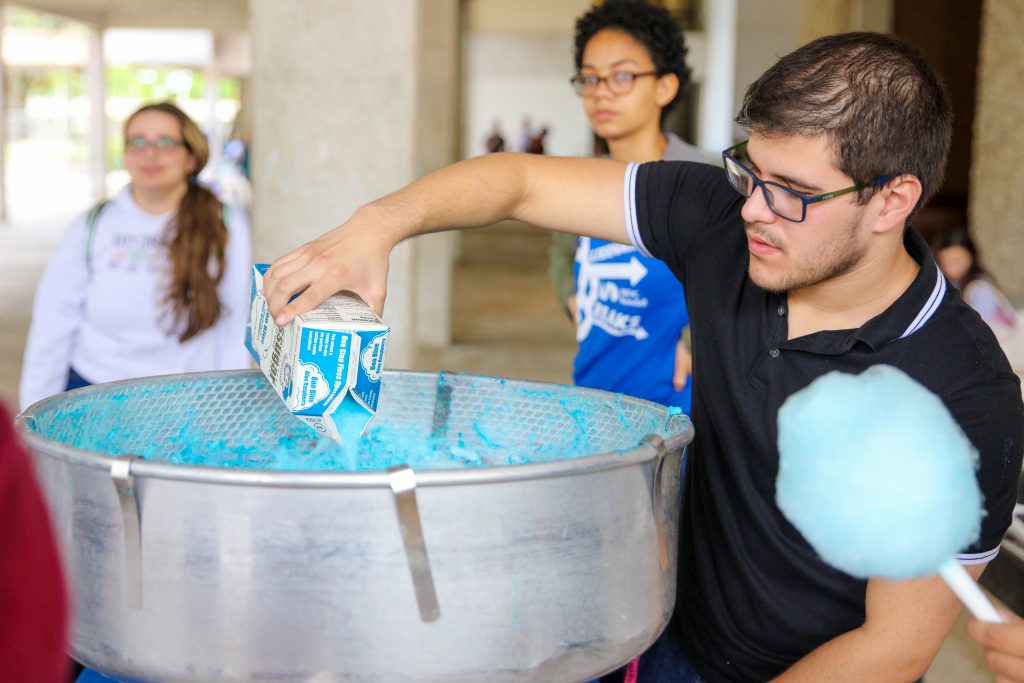 Student making cotton candy.