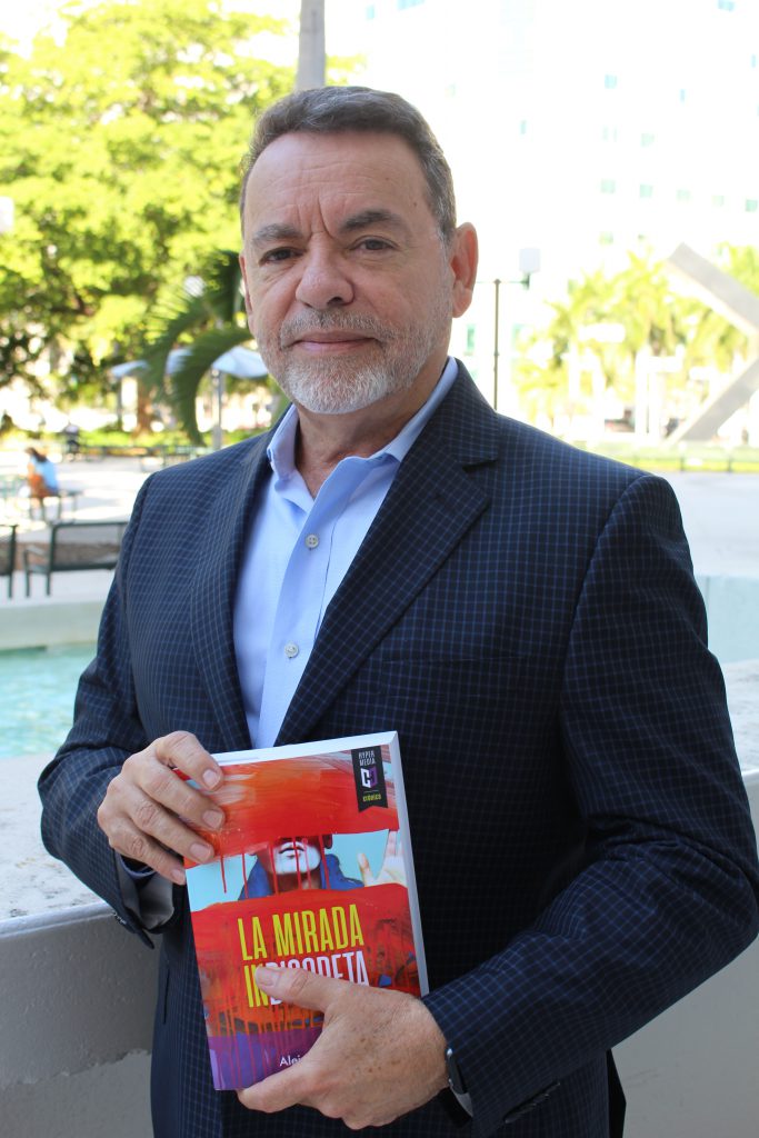 Alejandro Rios with his book.