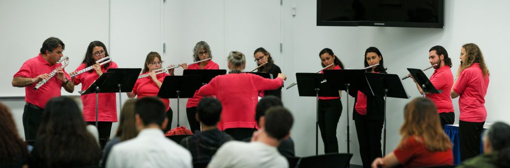 Students playing flutes.