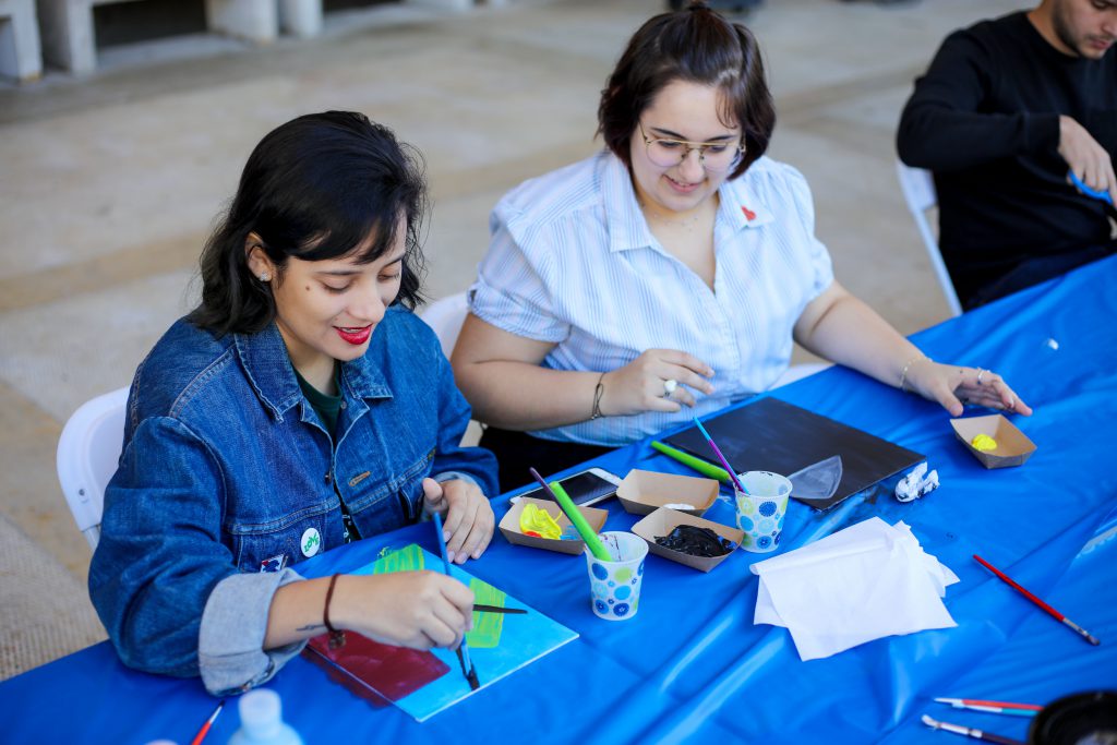 Students drawing at an event.