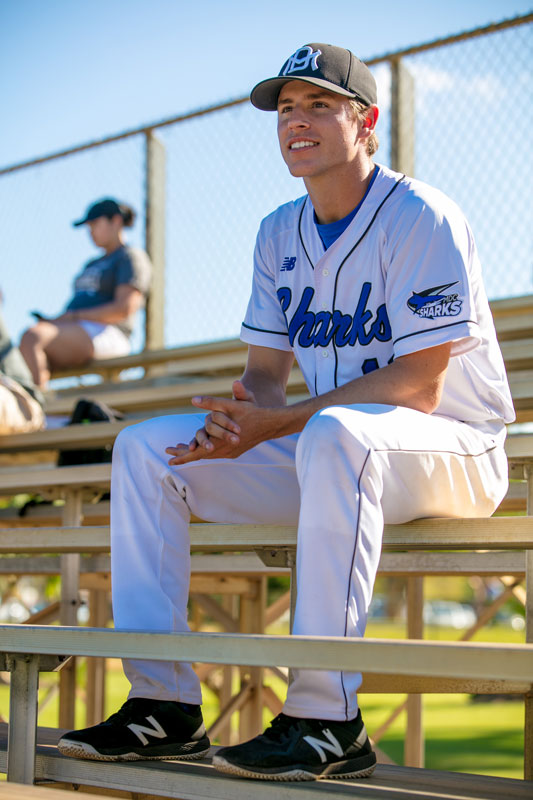 Garrett Bye sitting on the bleachers.