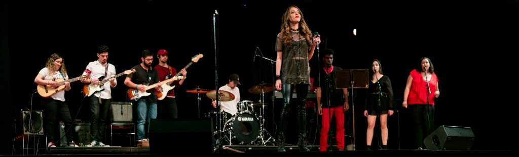 Students performing on stage..
