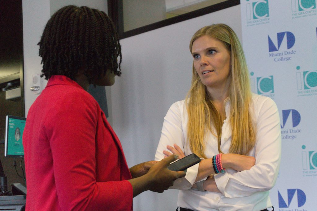 Johanna Mikkola speaking to someone.