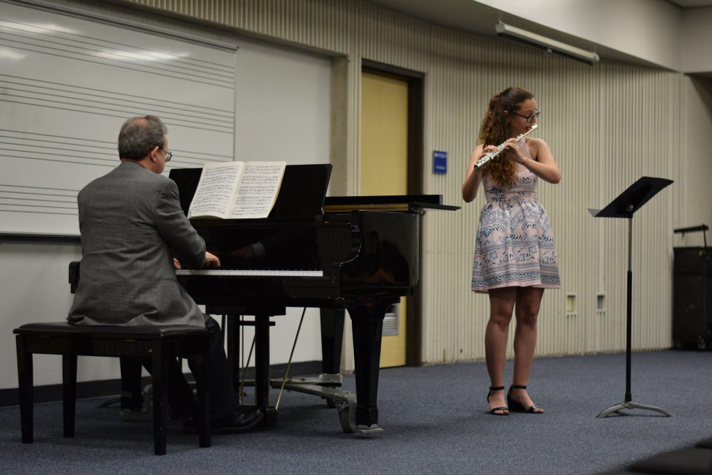 A student playing the flute.