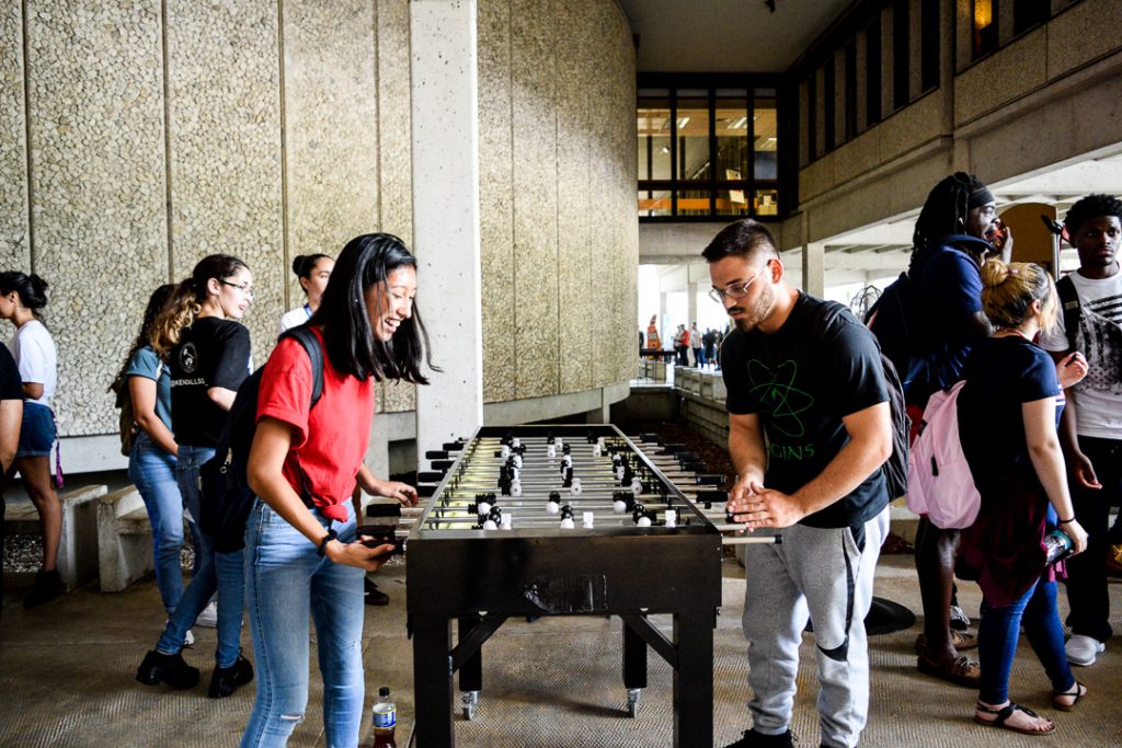 Students playing foosball.