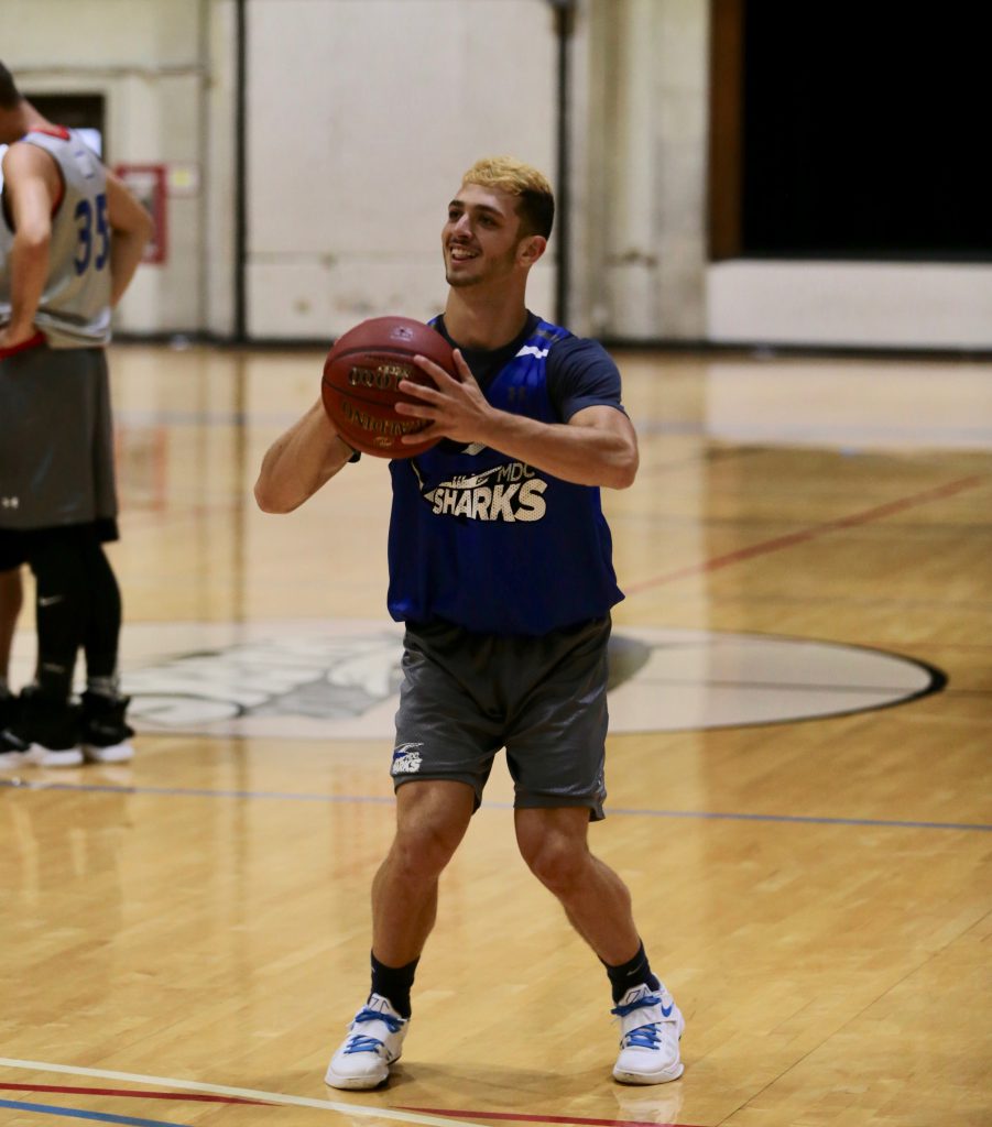 One of the Sharks, Ben Tal about to throw the ball.