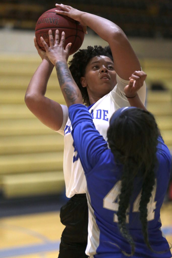 Michele Pruitt attempting to take a shot.