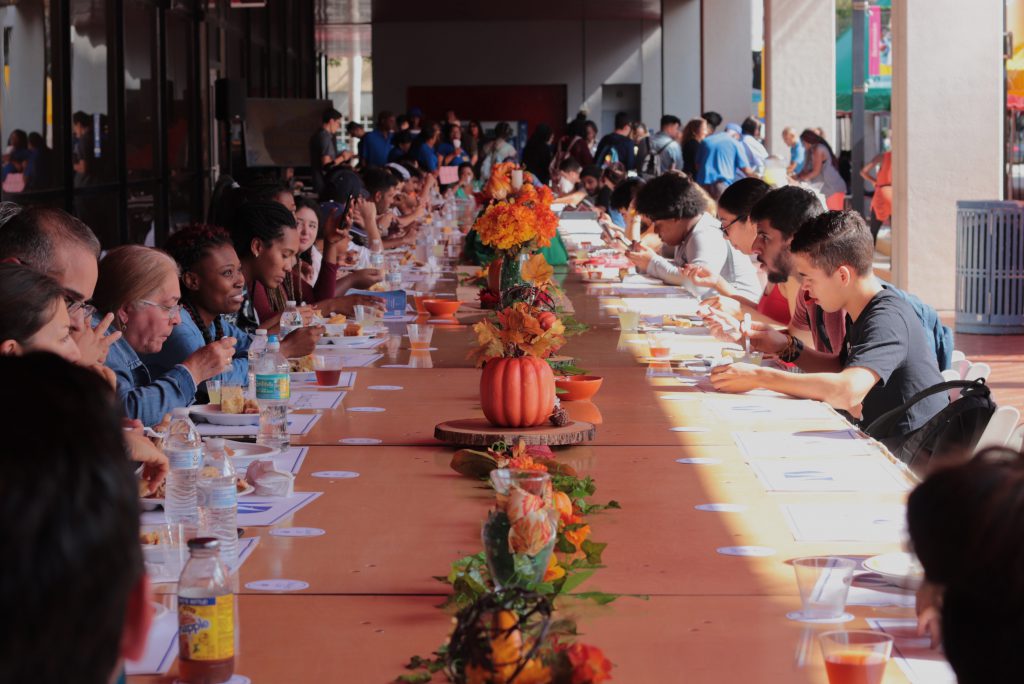 Students having Thanksgiving dinner.