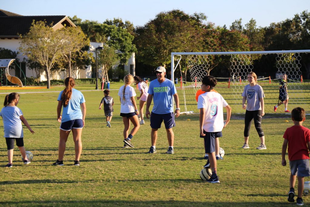 Paz with on the field with the children.