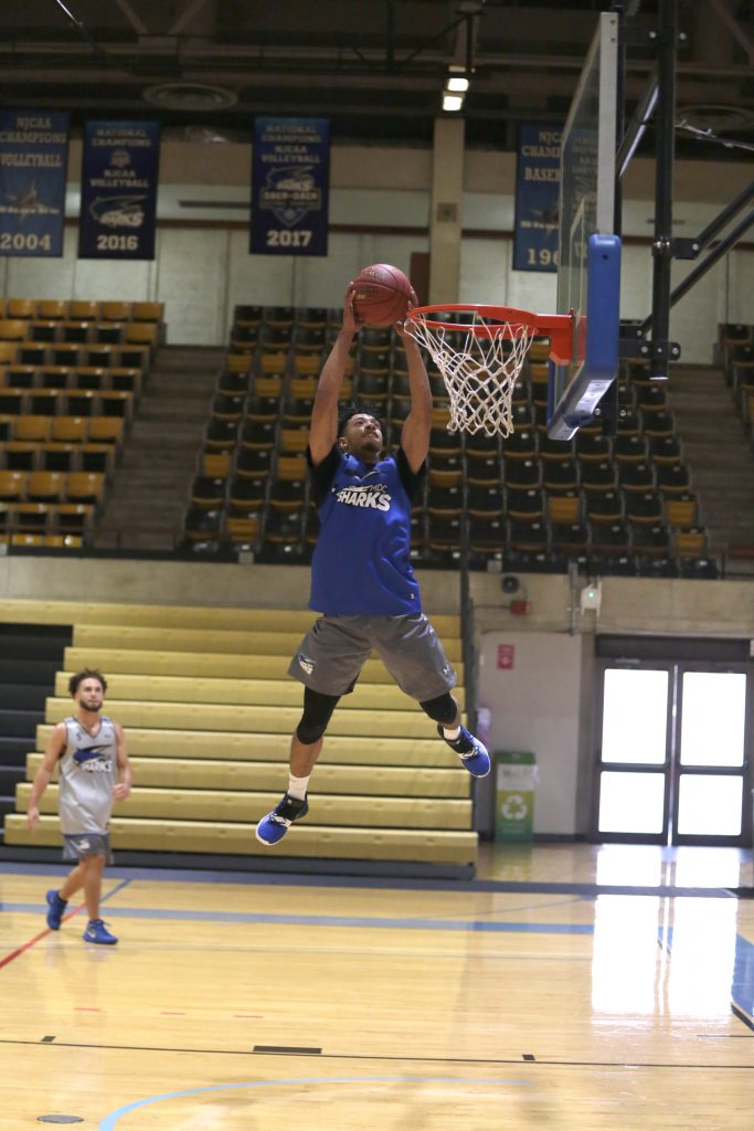 Montese Blake making a slam dunk.