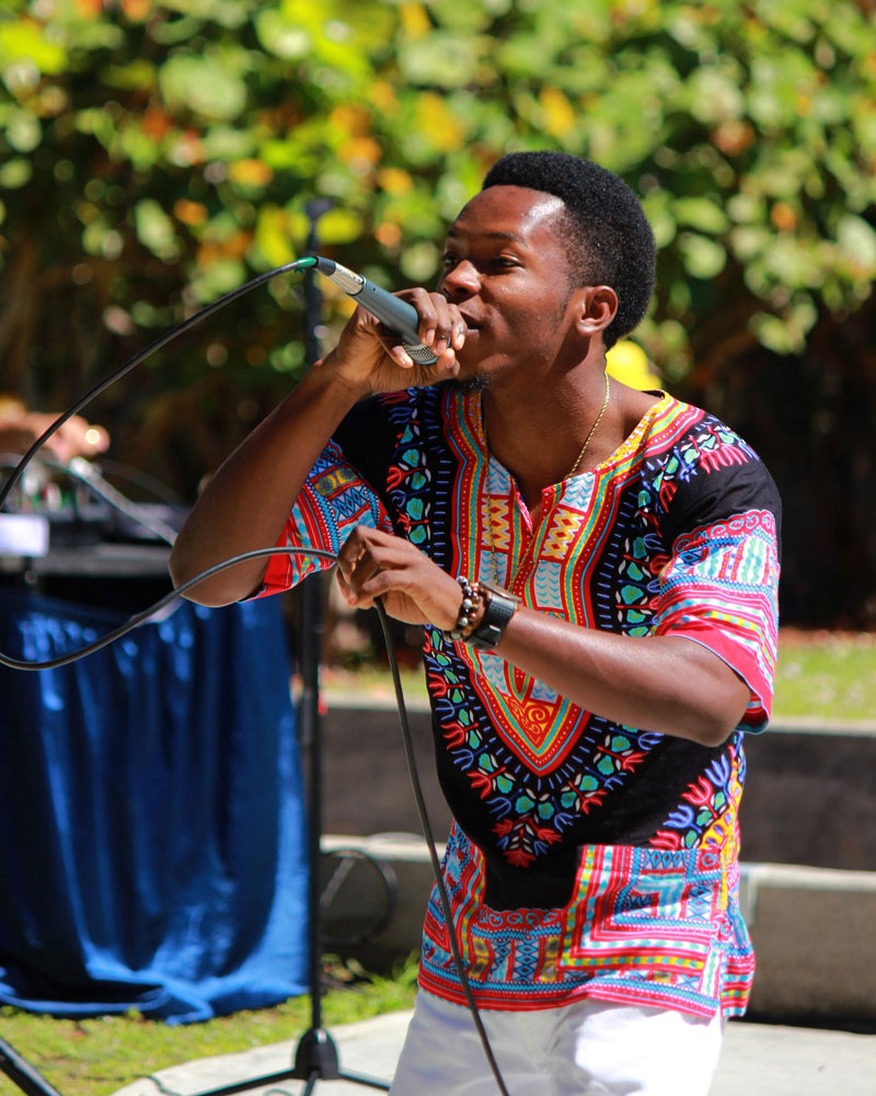 A student rapping on stage.