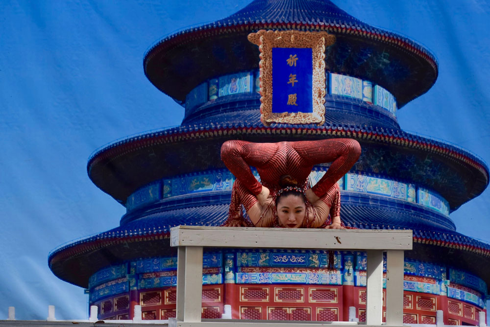 A member of the Chinese Cultural Foundation performing on stage.