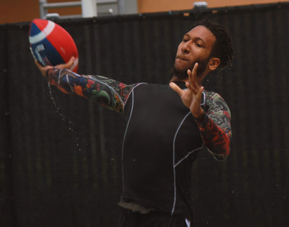Student playing football in the pool
