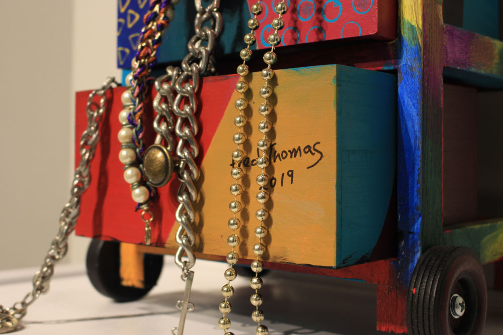 Photo of artwork details.