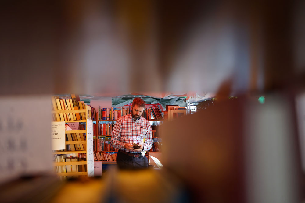 A man purchasing books.