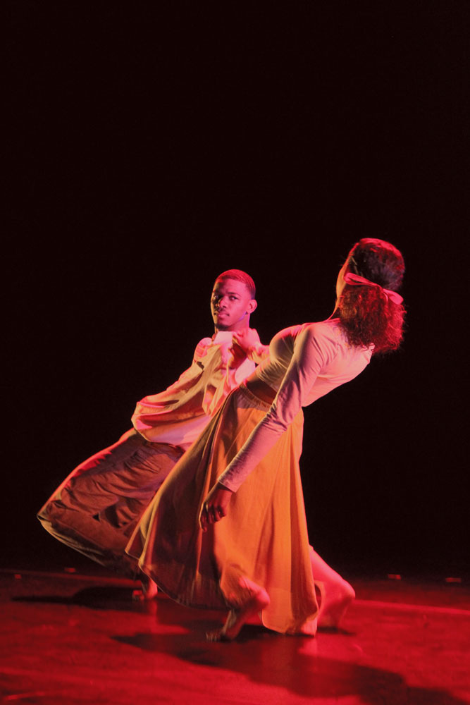 Students performing on stage.