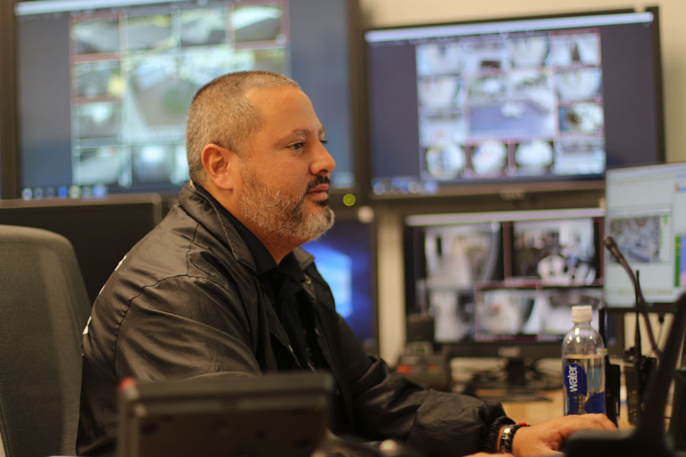 Sergio Rodriguez looking at security camera footage.