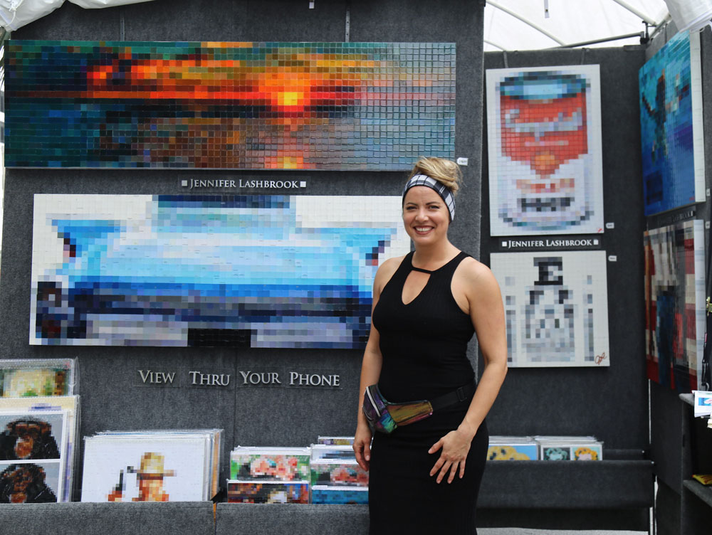 Jennifer Lashbrook posing with her art.