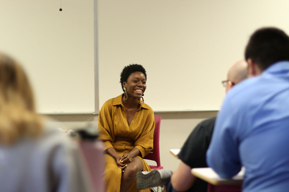 Kenisha Anthony discussing her memoir to a classroom. 