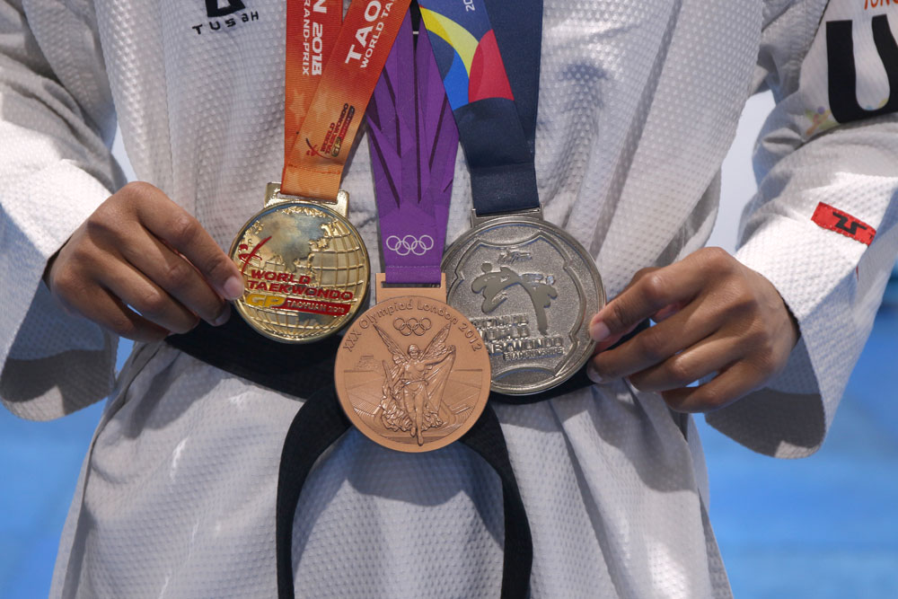 Paige McPherson showing off her medals.