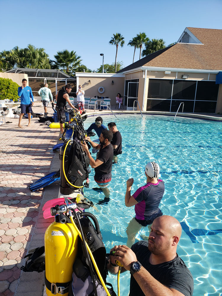 Students preparing their scuba gear.