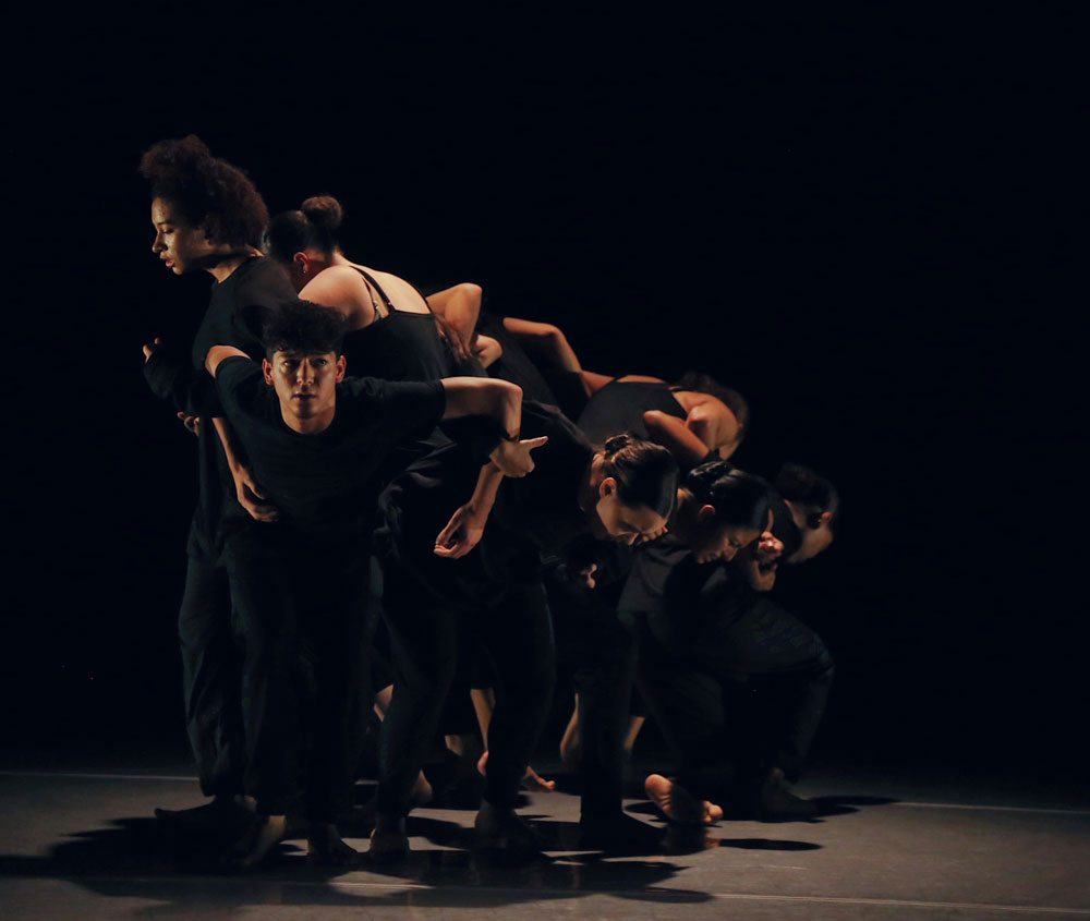 Students performing on stage.