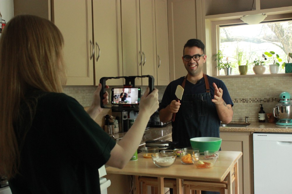 Gregory Castillo filming his cooking show.