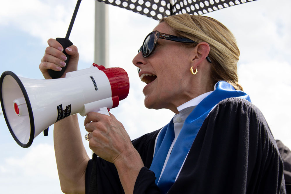 Elizabeth Ramsay speaking to the professors.